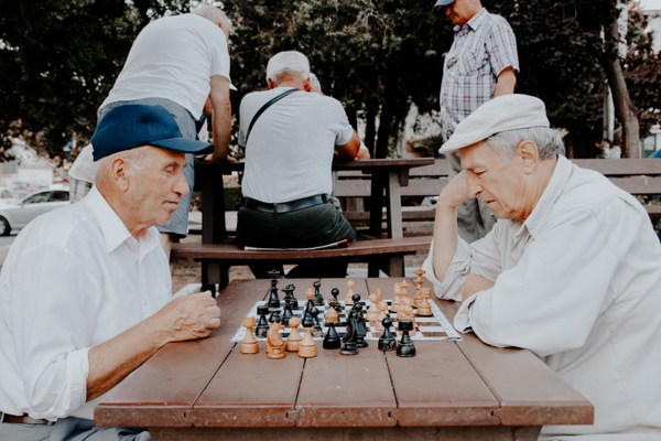 modern retirees playing chess